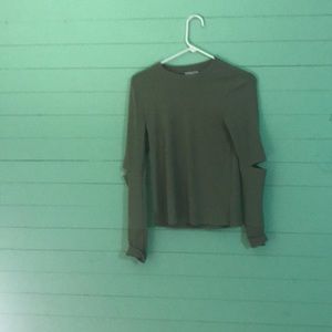A green off the shoulder shirt